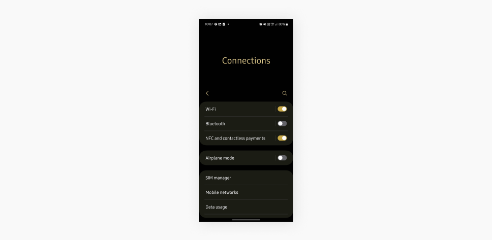 A screenshot showing the Connections tab of Android settings, displays toggles for WiFi, Bluetooth, and NFC.